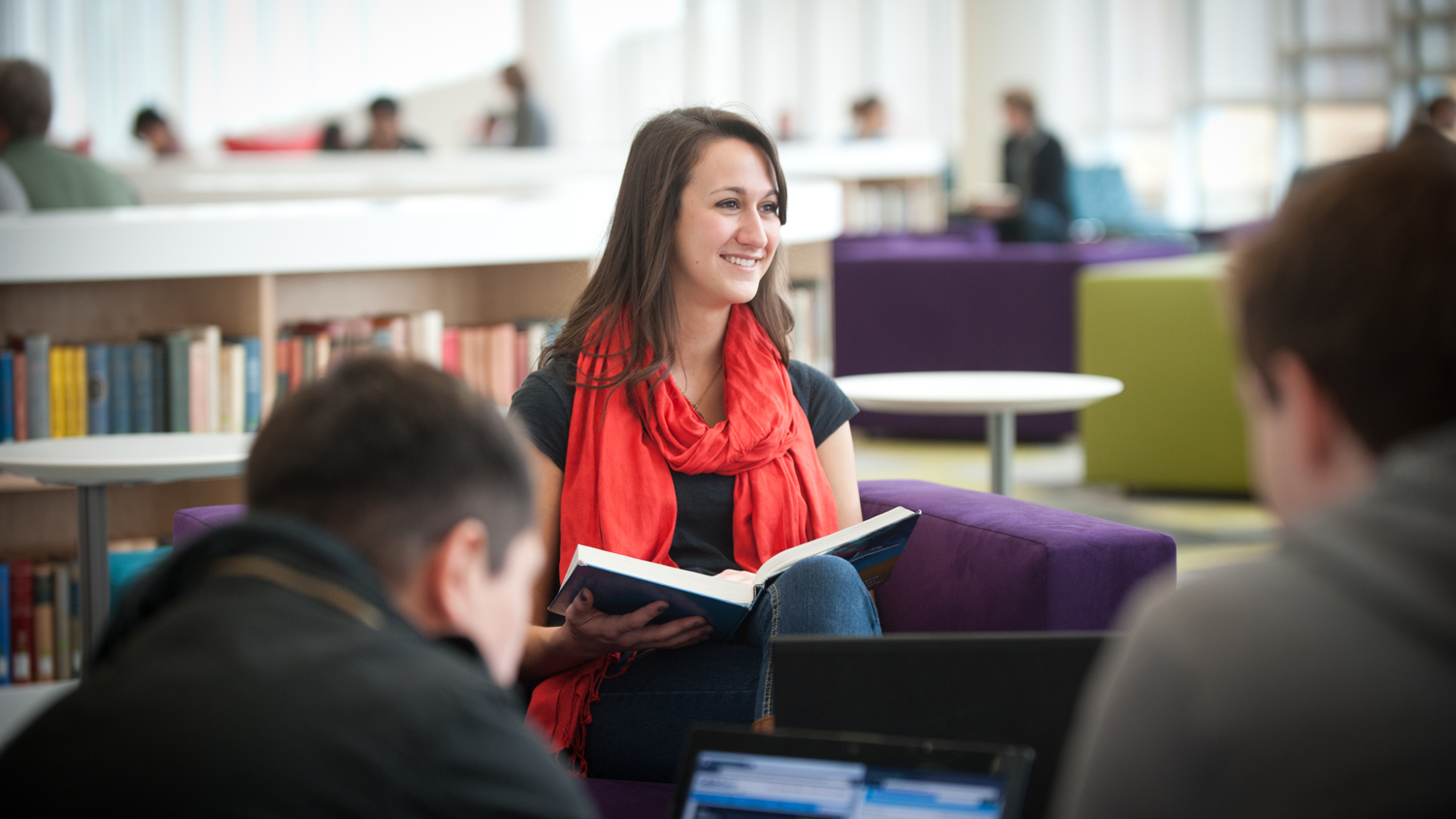 Student reading in library