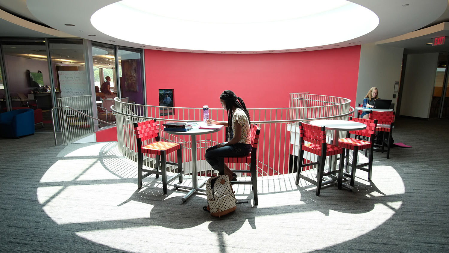 Student studies alone near stairwell at Talley Student Union