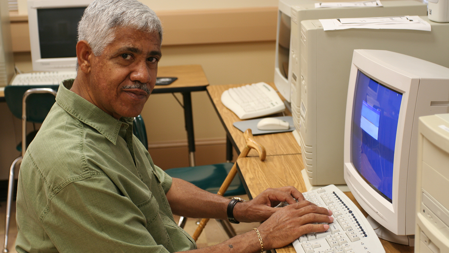 Man typing at PC