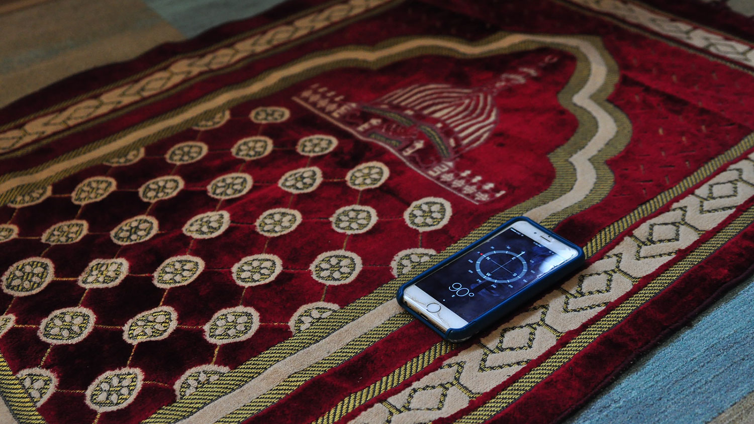 Prayer rug and compass