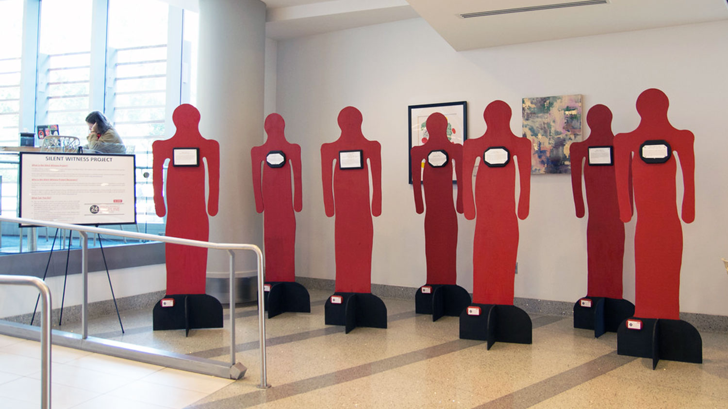 Red cutout figures for Silent Witness Project