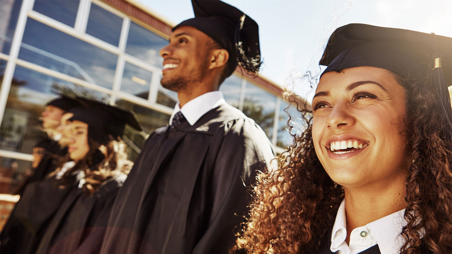 Photo of new graduates in mortarboards