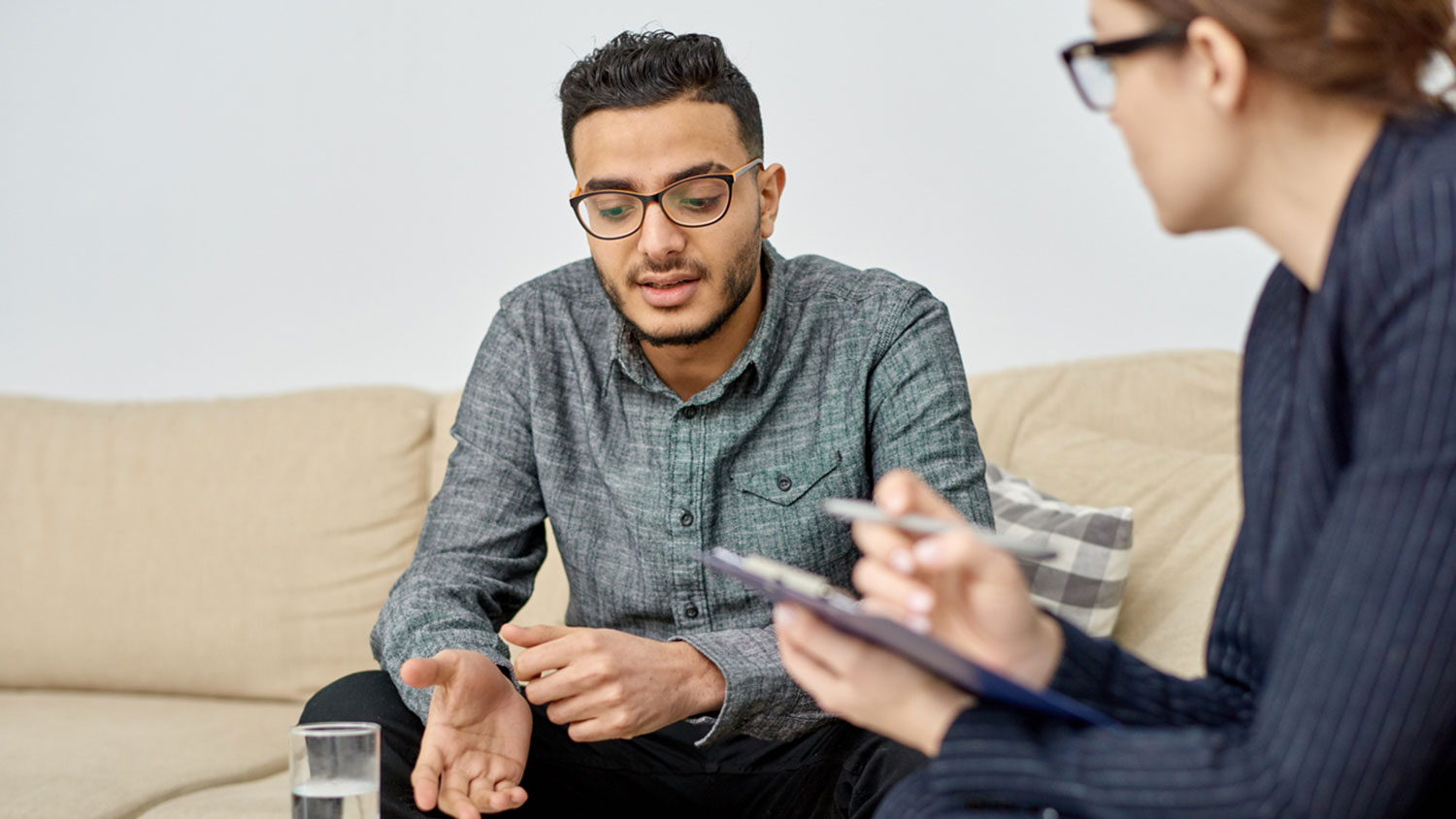 Male-identified person in consulation session