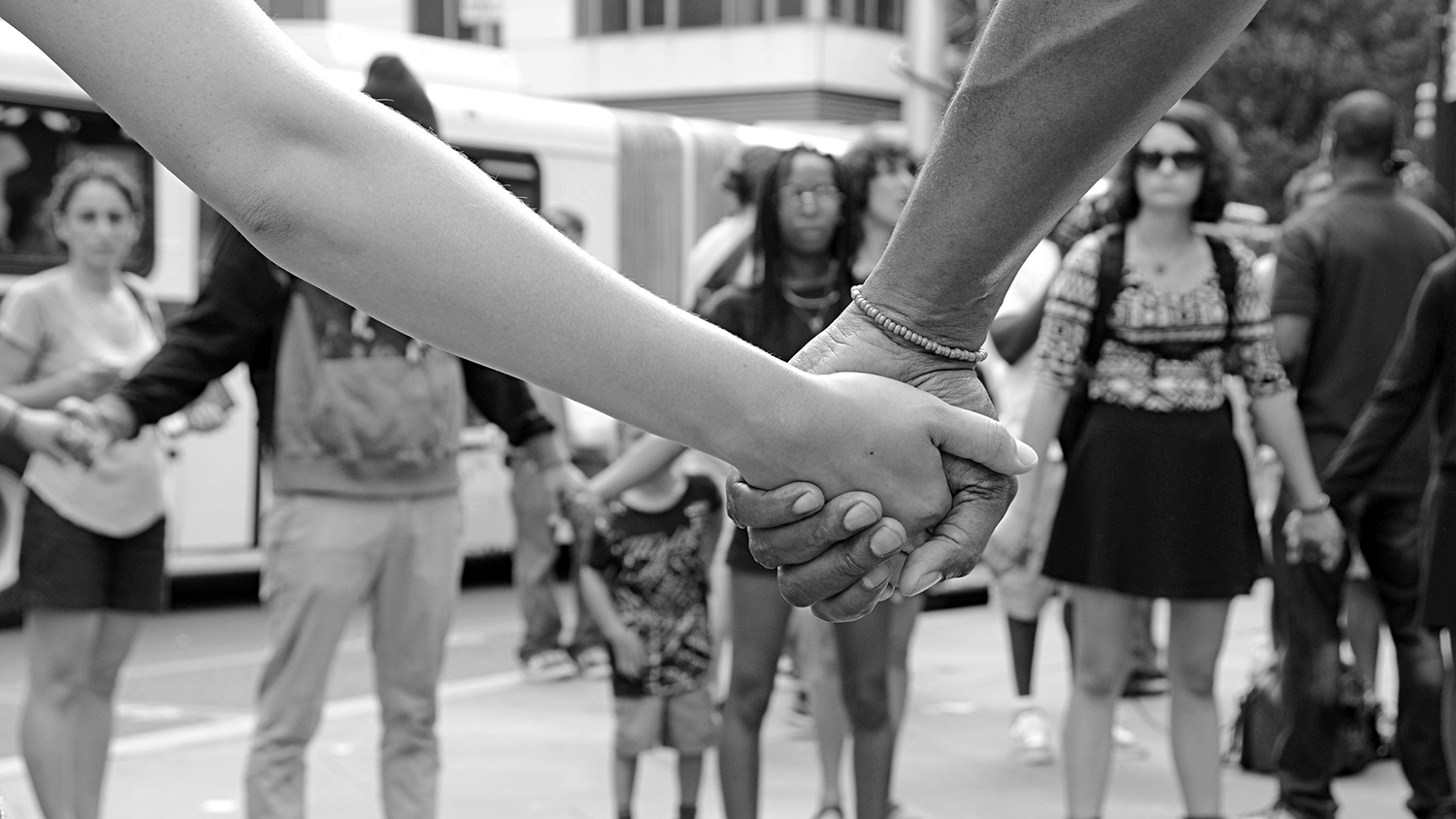 Protestors holding hands