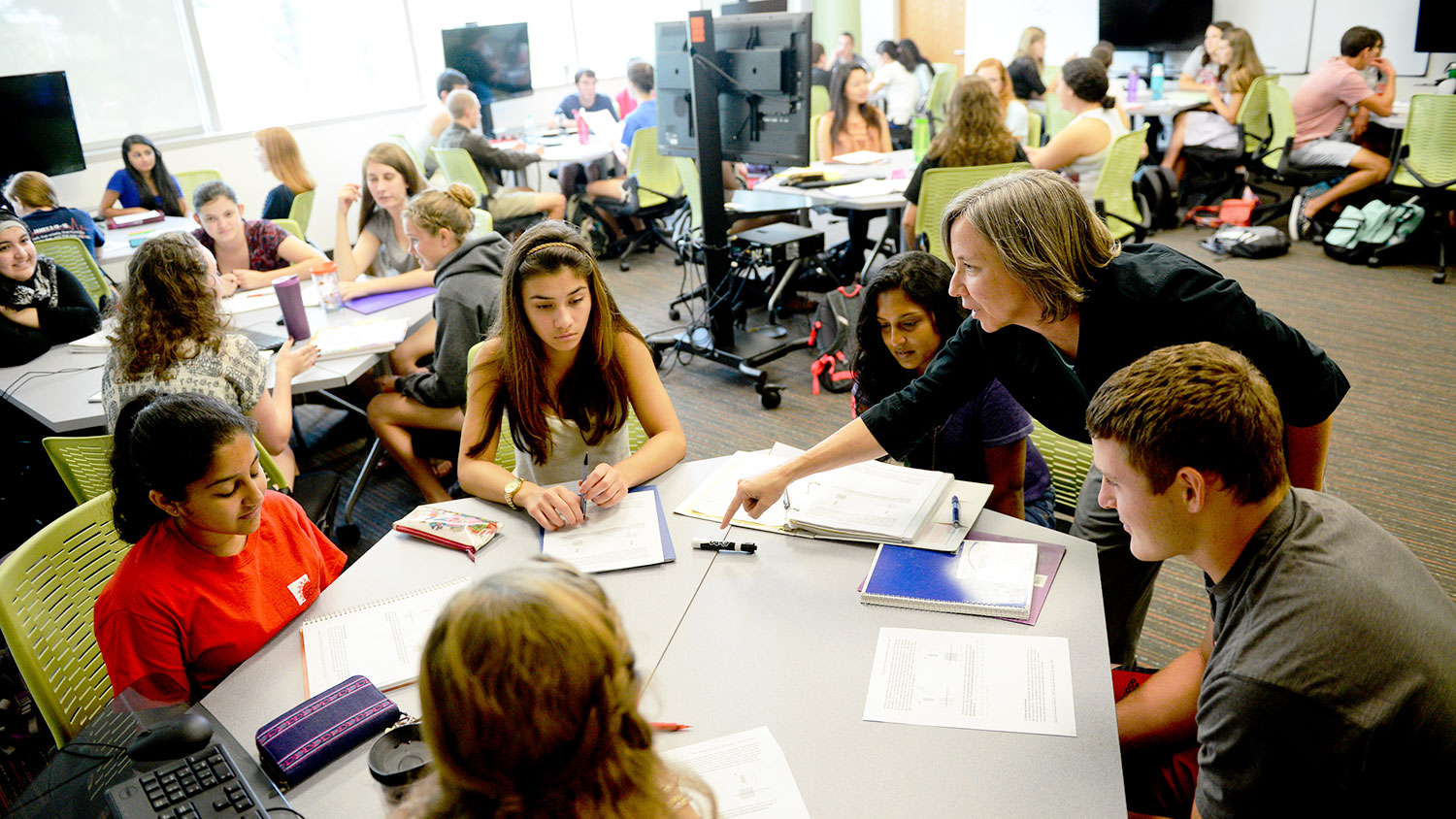 Students doing hands-on learning with an instructor