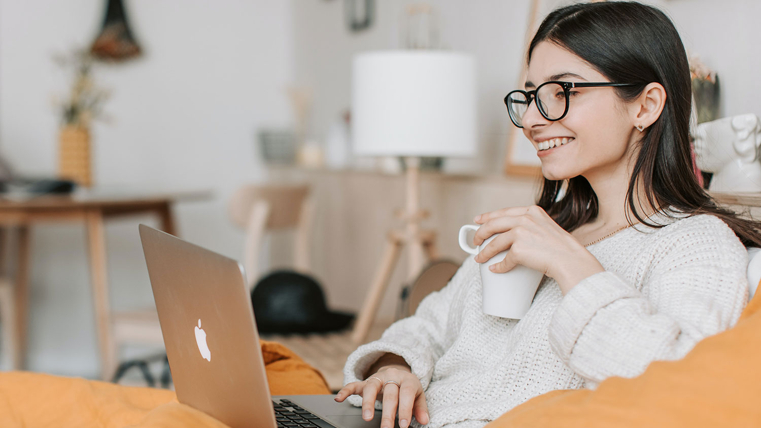 Woman smiling while taking online training