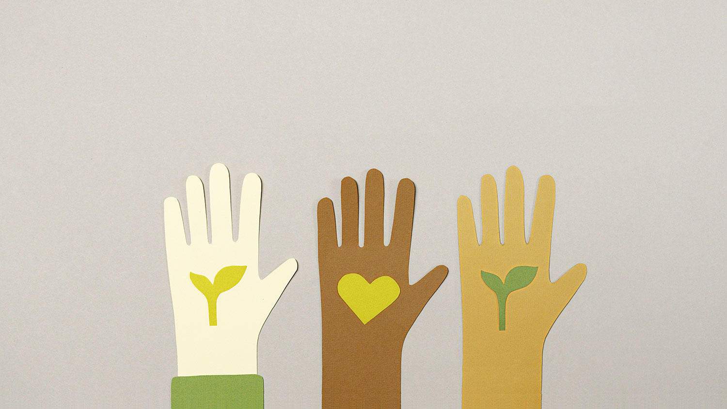 Multicultural hands with plants for Earth Day