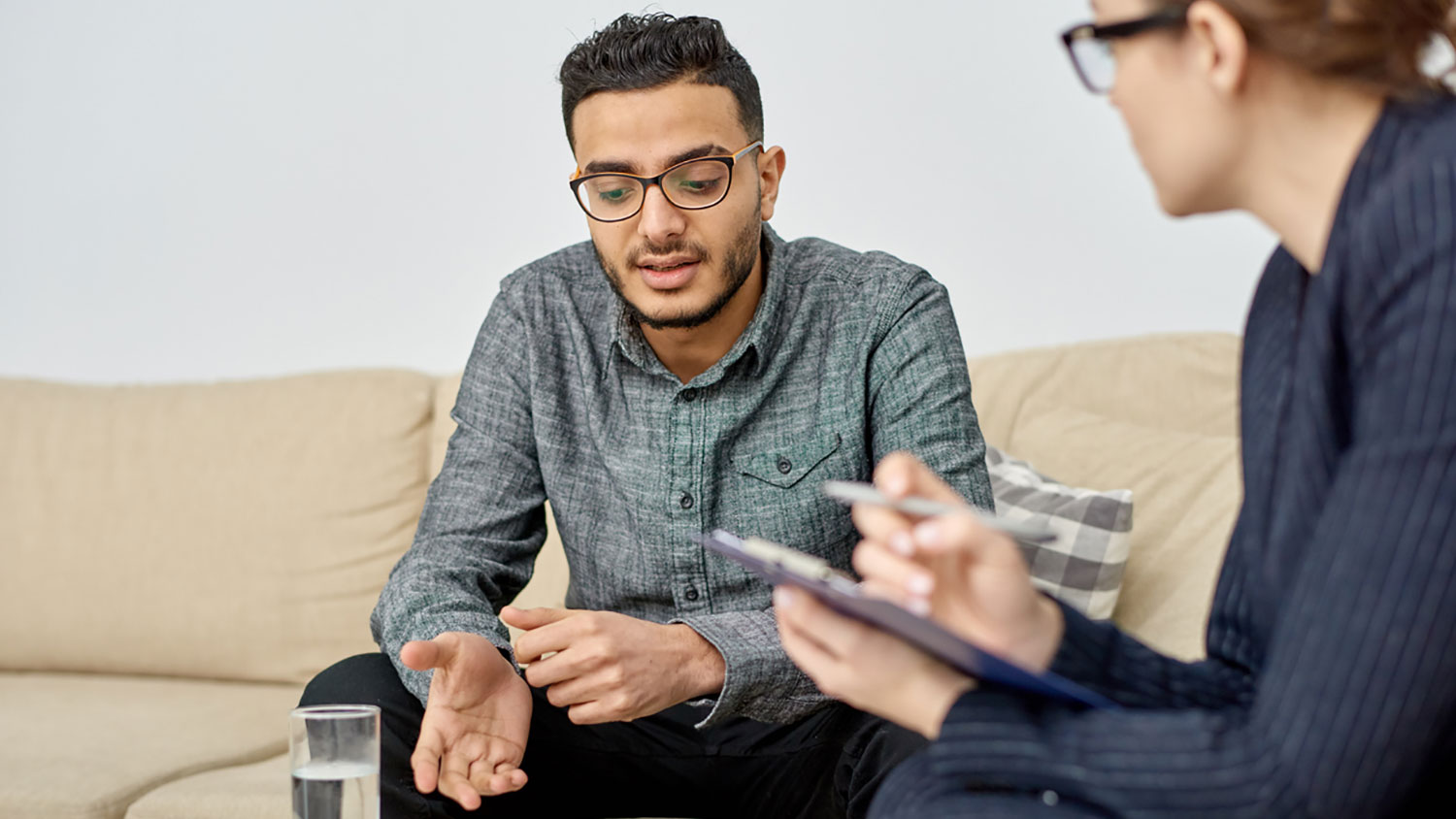 Person speaking with a staff member