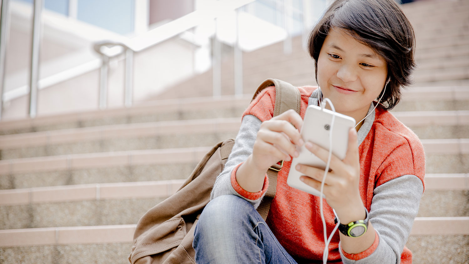 Young Asian woman looking at phone