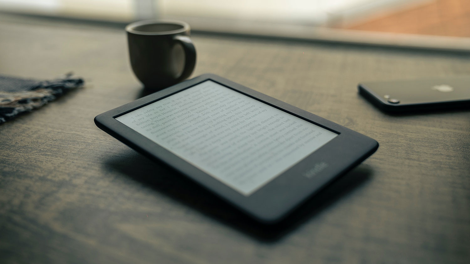 e-reader and mug