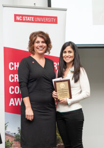 Sheri Schwab, Vice Provost for Institutional Equity and Diversity awarded Maru Gonzales the Chancellor's Creating Community Award at the annual RED Event last spring.