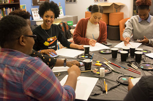 Painting workshop participants enjoy the process