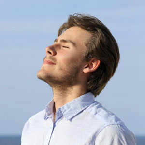 Young man with eyes closed